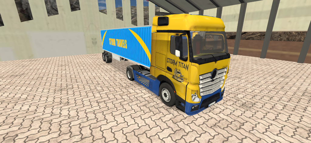 Truck Games Euro Truck Driving - Camión cisterna amarillo y azul llamado Storm Titan en un juego de simulación de conducción de camiones.