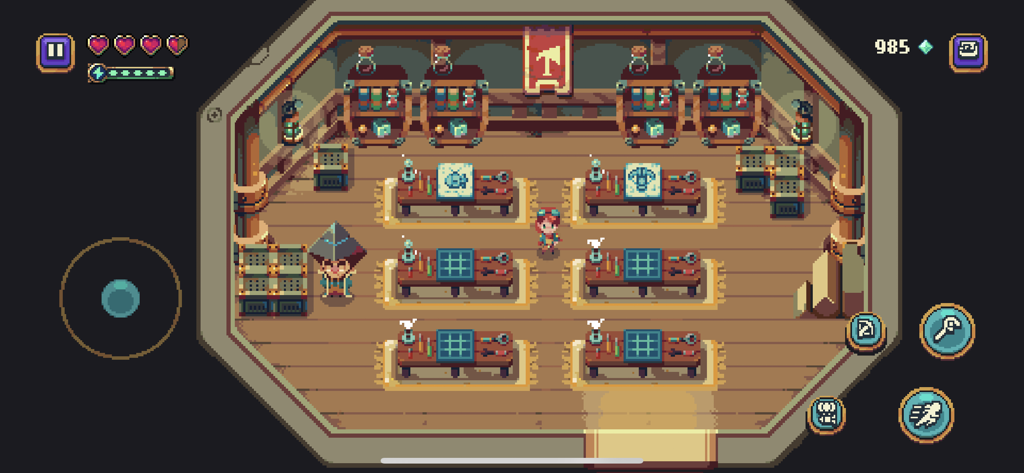 Sparklite - A top-down pixel art view of a workshop interior with workbenches and blueprints in Sparklite.