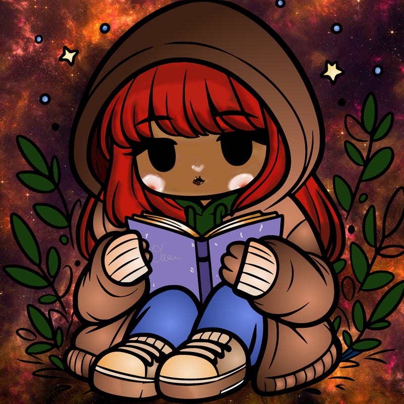 girl in oversized hoodie reading a book
