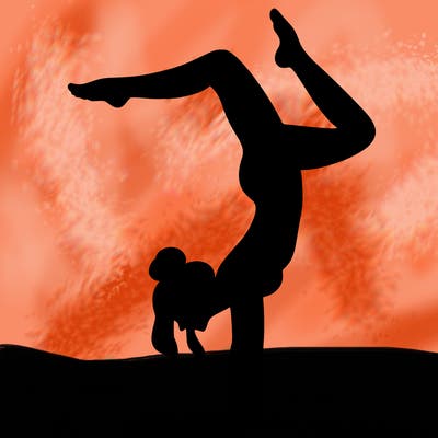 a woman doing a handstand