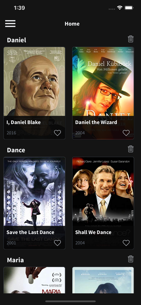 Tela inicial do aplicativo Mis Películas exibindo pôsteres de filmes categorizados como I Daniel Blake e Shall We Dance com ícones de favoritos