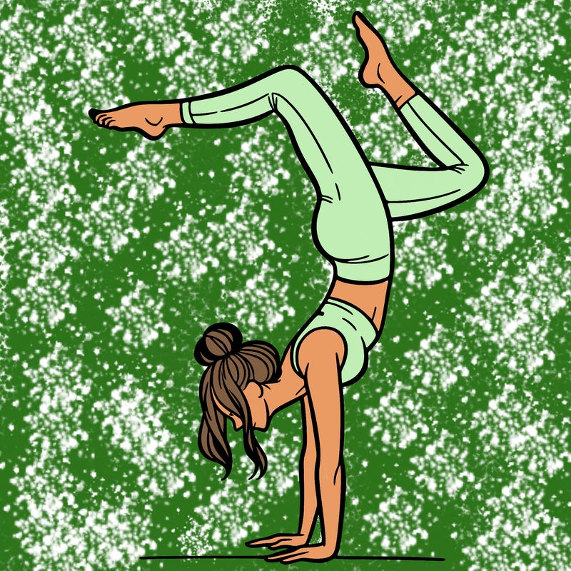 a woman doing a handstand