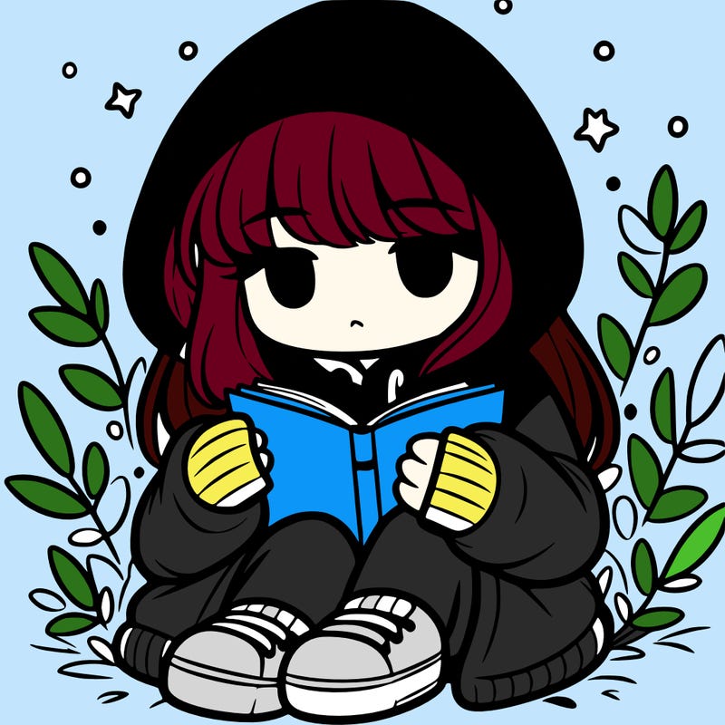 girl in oversized hoodie reading a book