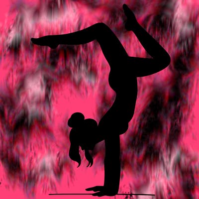 a woman doing a handstand