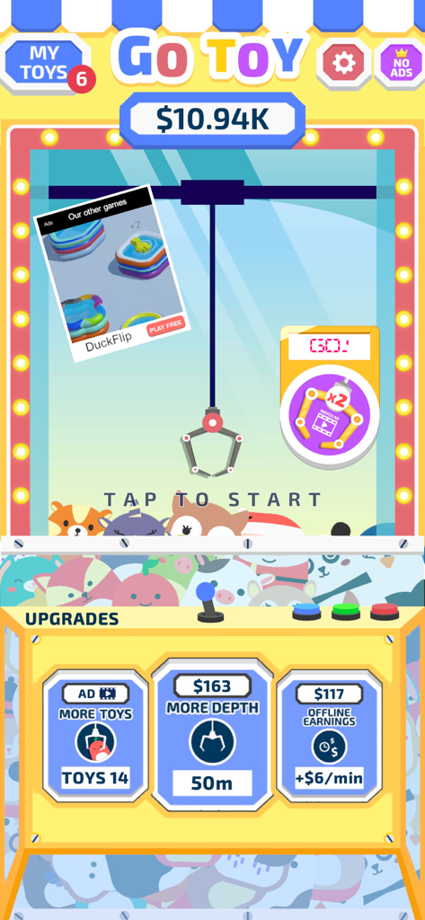 Go Toy! - Go Toy mobile game screen showing a virtual claw machine and upgrade menu
