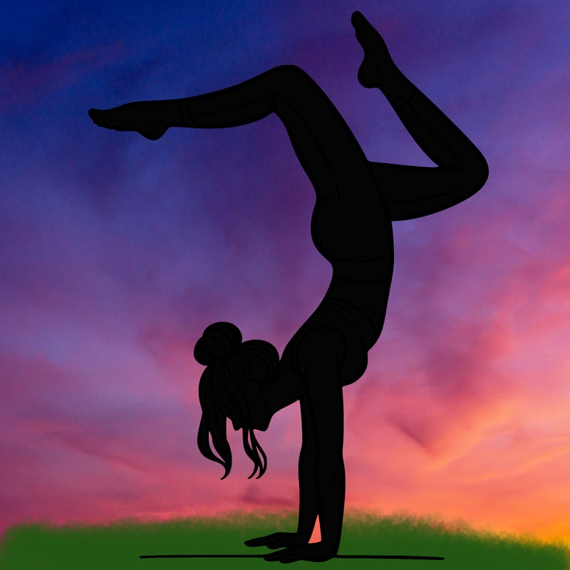 a woman doing a handstand