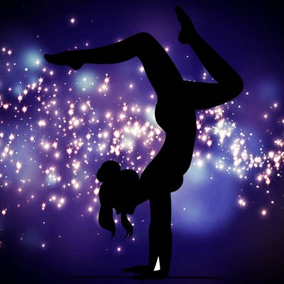 a woman doing a handstand