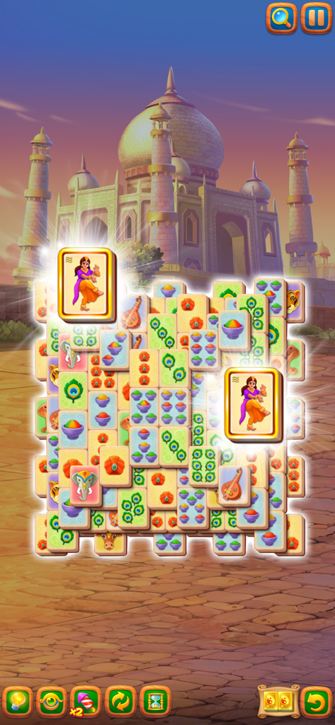 A Mahjong tile matching game screen featuring the Taj Mahal in the background