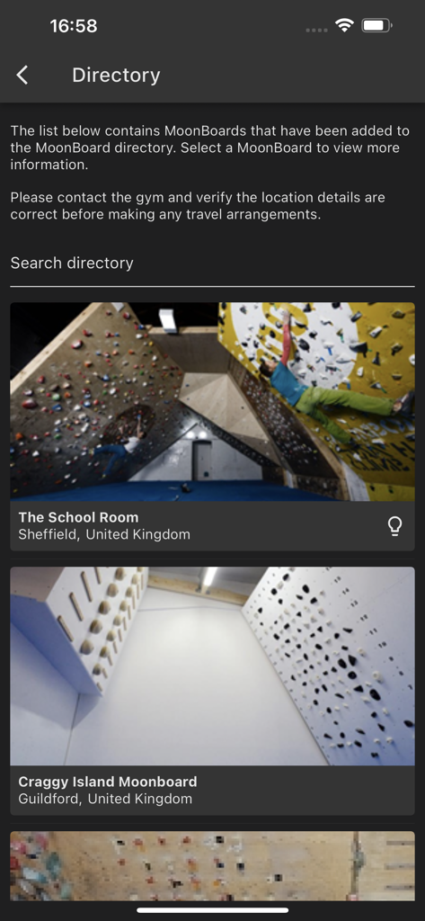Moon Board - The directory screen of the Moon Board app listing available climbing gym locations with photos of their MoonBoards