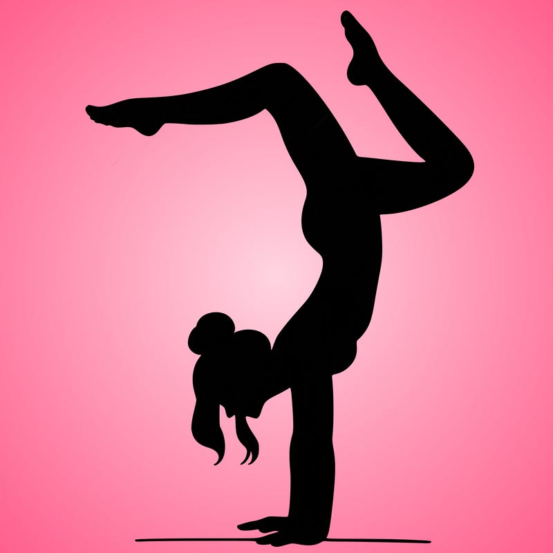 a woman doing a handstand
