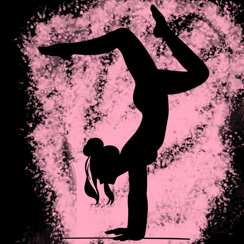 a woman doing a handstand