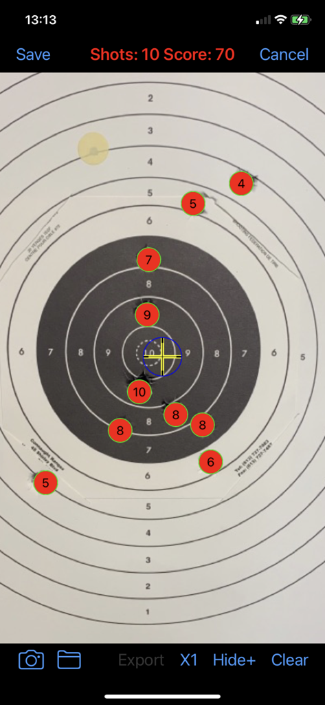 A digital interface showing a shooting target with shot scores and point of impact calculation