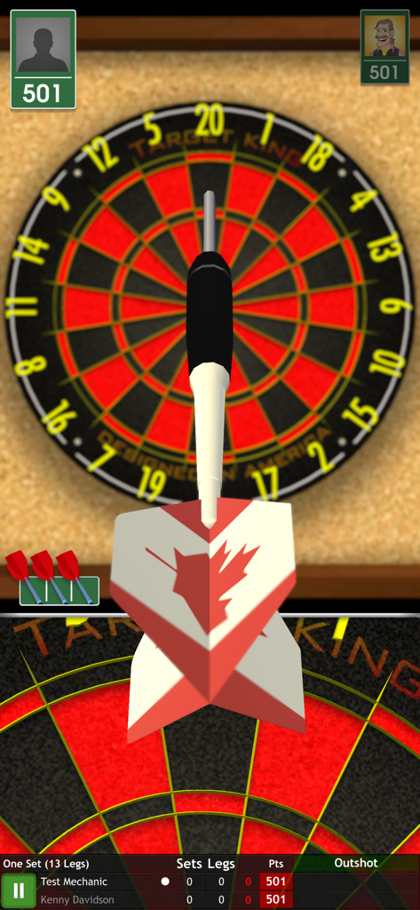 A close up view of a dart with a maple leaf flight aimed at a dartboard in Bulls i Darts Masters Edition.