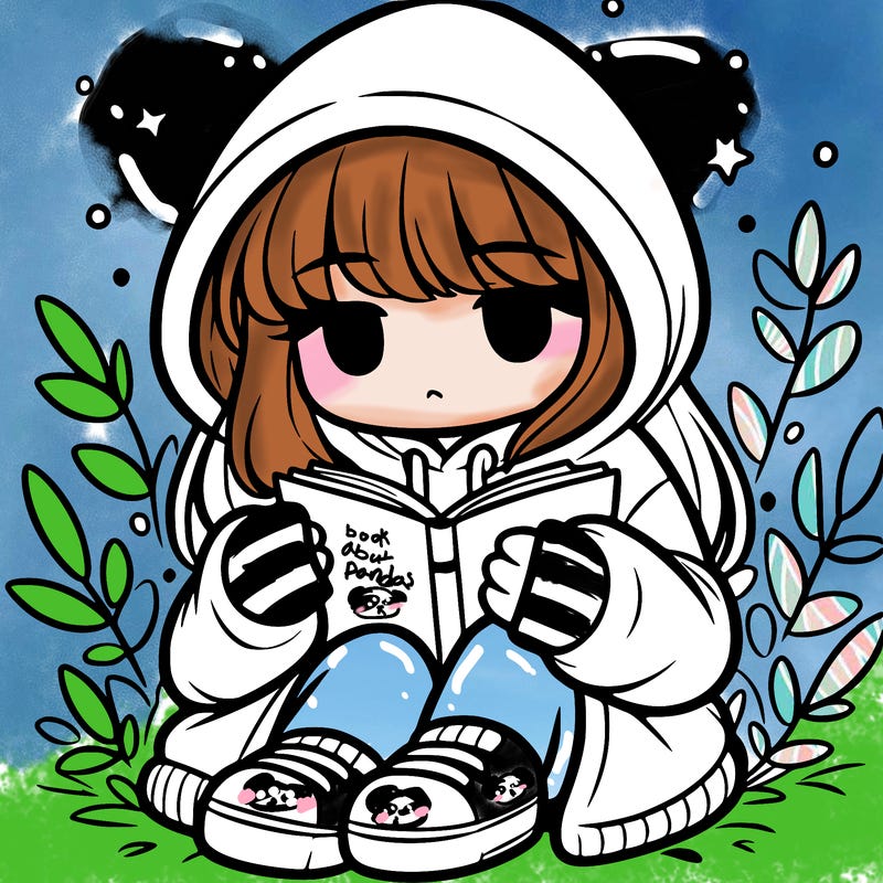 girl in oversized hoodie reading a book