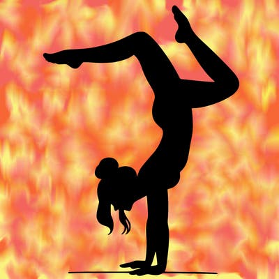 a woman doing a handstand