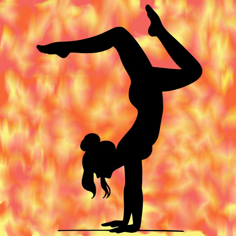 a woman doing a handstand