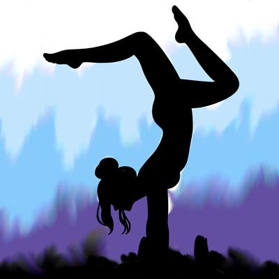 a woman doing a handstand