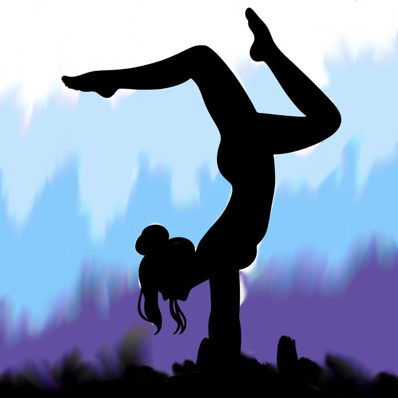 a woman doing a handstand