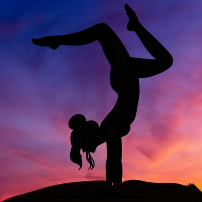a woman doing a handstand