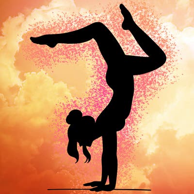 a woman doing a handstand