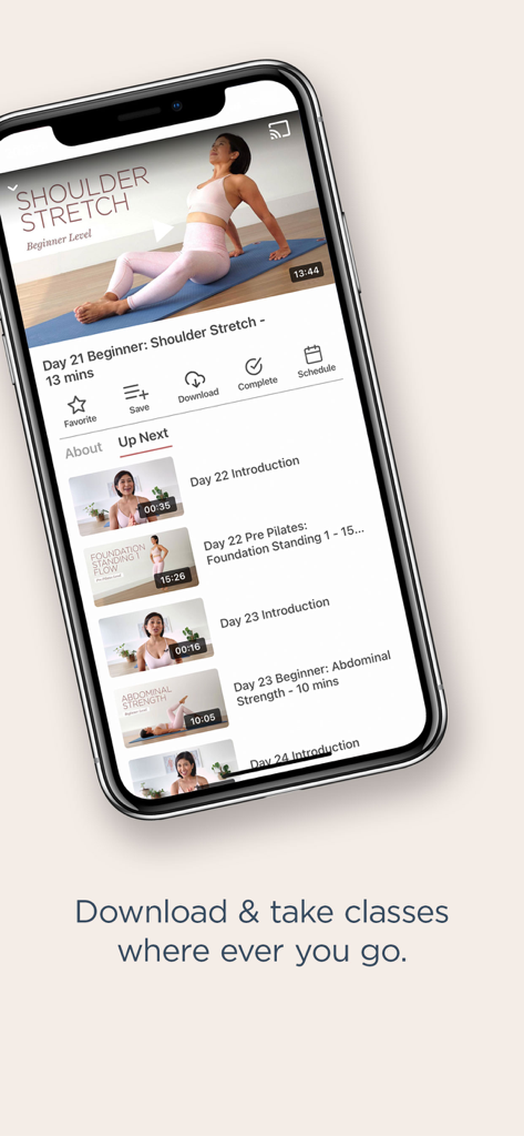 Flow with Mira Pilates - Smartphone screen showing the Flow with Mira Pilates app interface with a shoulder stretch video and a list of upcoming classes.