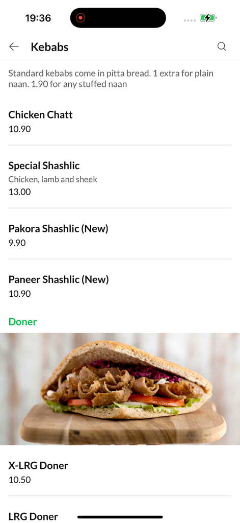 The New Adnan Tikka - Interfaccia dell'app mobile per The New Adnan Tikka che mostra un menu di vari kebab e una foto di un doner