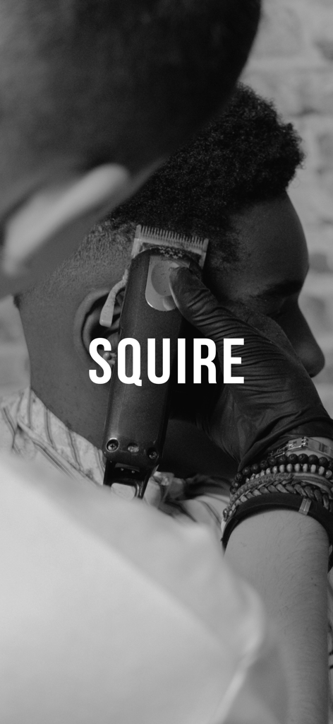 SQUIRE™ - Professional barber giving a haircut with electric clippers in black and white