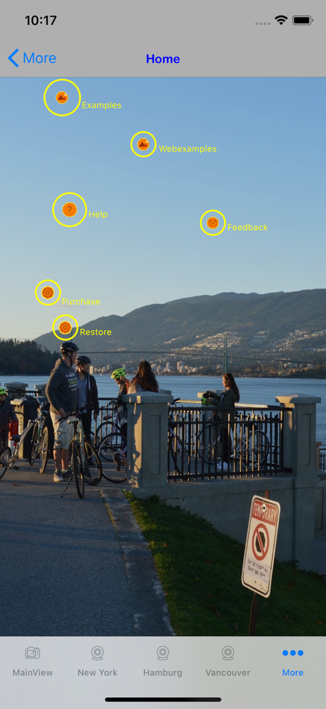 Webcam World Viewer - Webcam World Viewer app interface showing menu buttons for examples and settings over a scenic landscape background