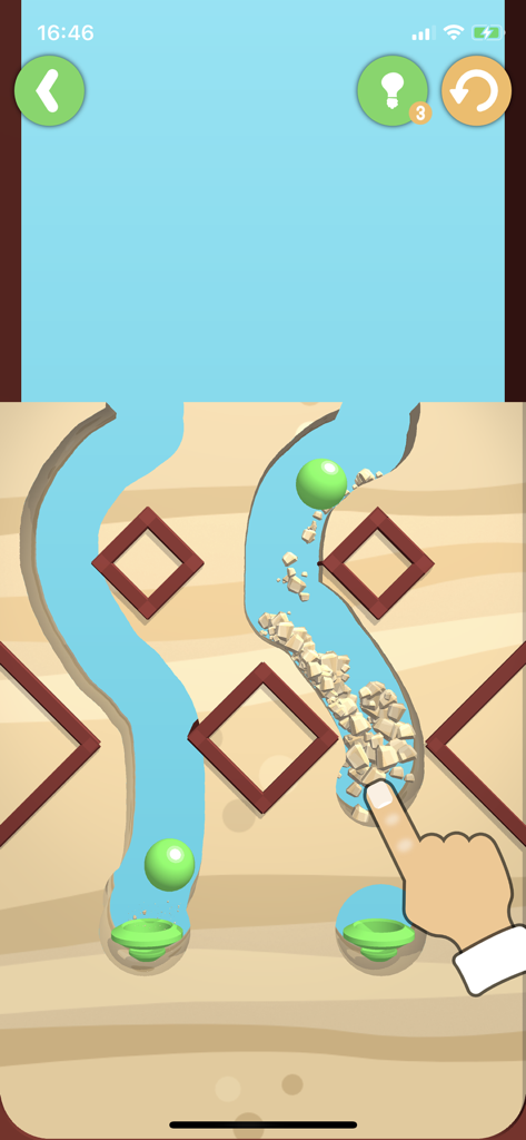 Dig This! - Dig Thisアプリで、緑のボールをカップに導くために砂に道を作る手を描いたもの