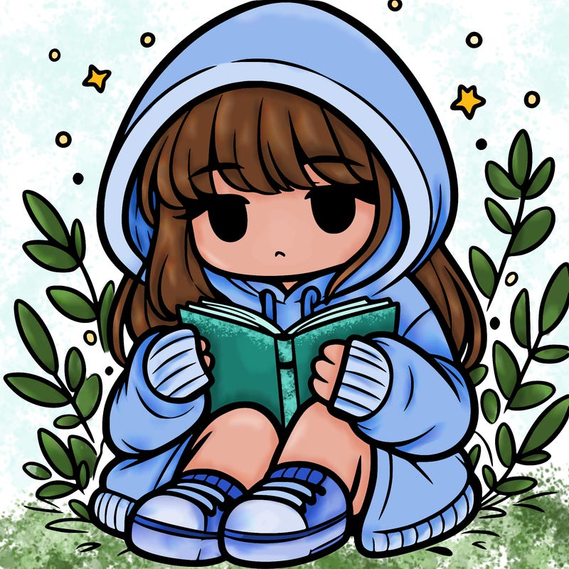 girl in oversized hoodie reading a book