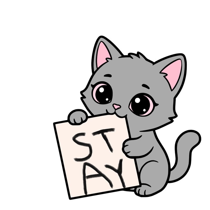 a small cat with a blank sheet of paper in its hand. the cat is sooooooo cute!