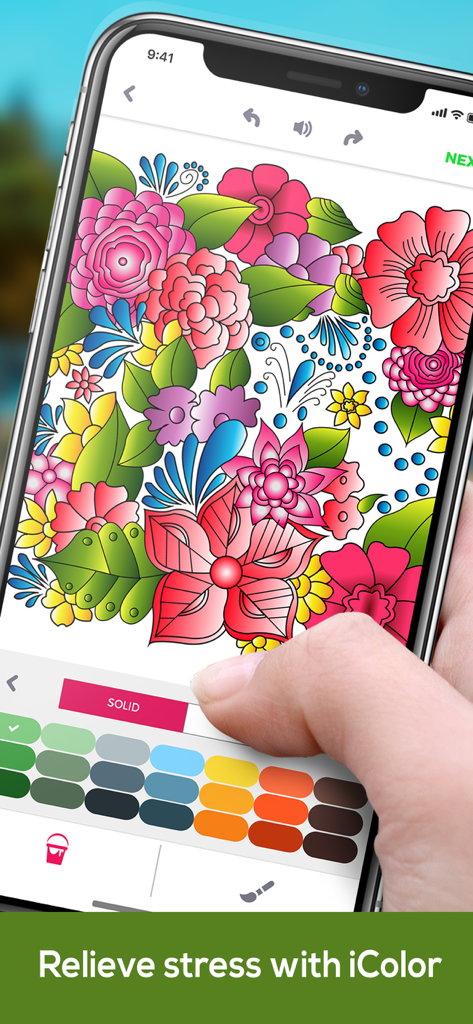 Coloring Book For Adults App ◌ - A person using the iColor app on a smartphone to color a detailed floral design for stress relief