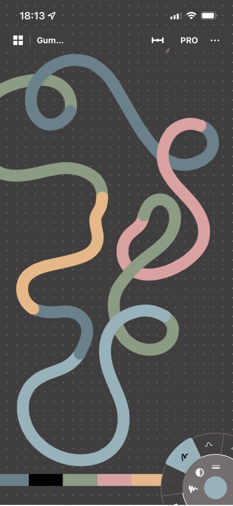 Concepts - Uma linha vetorial multicolorida e em loop em uma tela de grade escura dentro da interface do aplicativo Conceitos.