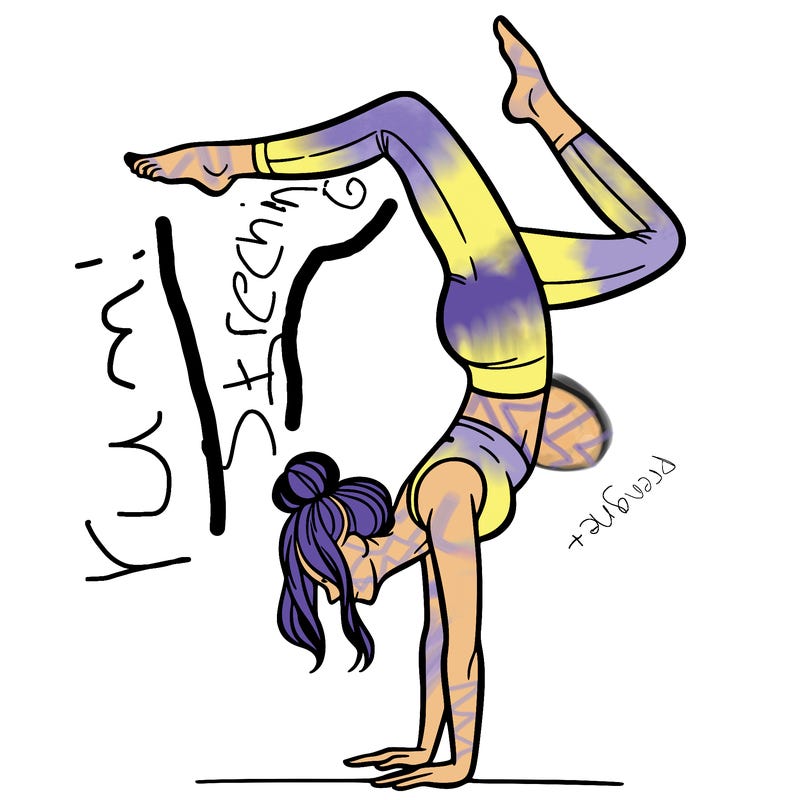 a woman doing a handstand