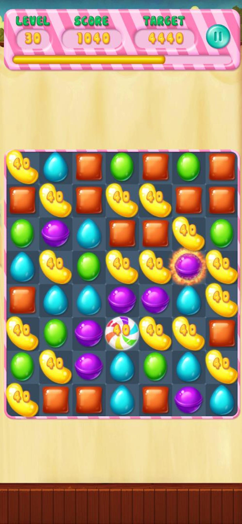 Candy Rescue Frenzy のカラフルなマッチ3パズルグリッド。さまざまなキャンディーの形とレベル目標を表示。
