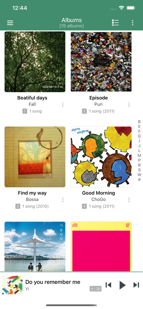 jetAudio Hi-Res Music Player - jetAudio Hi-Res Music Player albums library view showing a grid of album art and a mini player at the bottom.