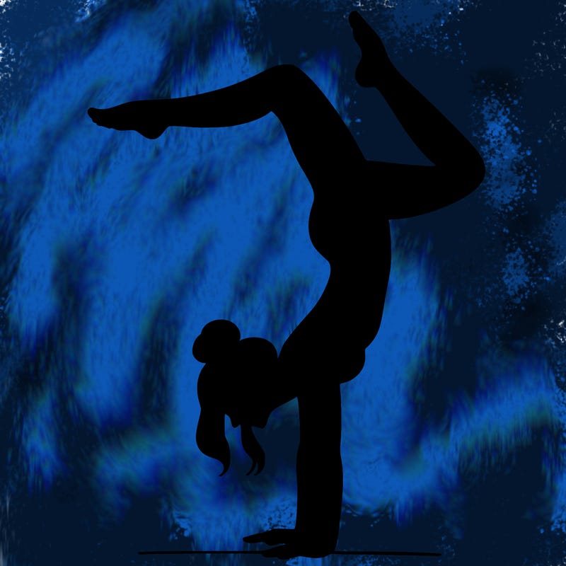 a woman doing a handstand