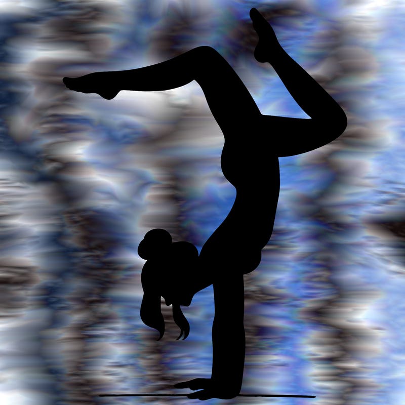 a woman doing a handstand