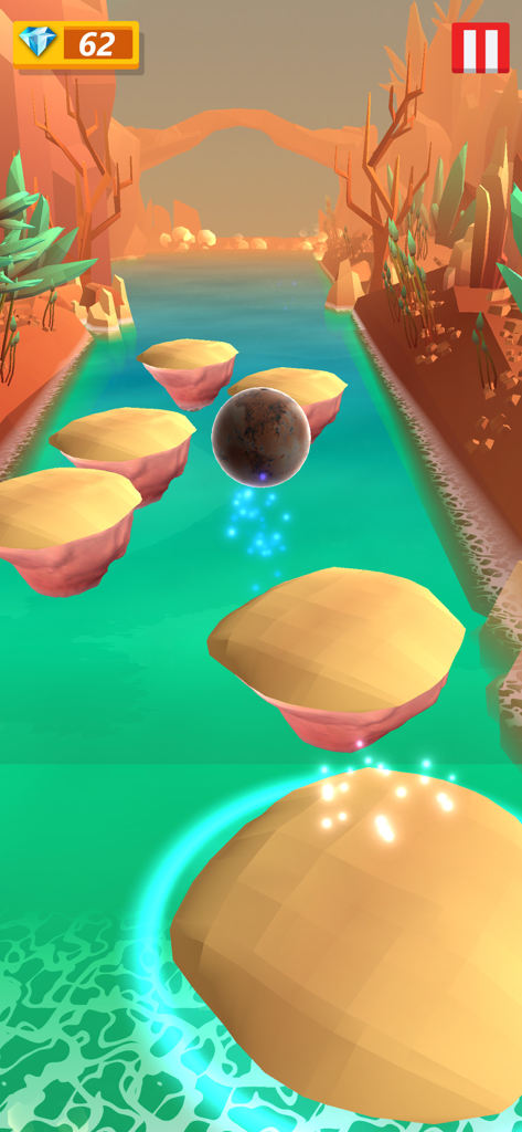 Hop Ball 3D Music Games - A 3D ball jumping on floating tiles over a river in a desert canyon setting.