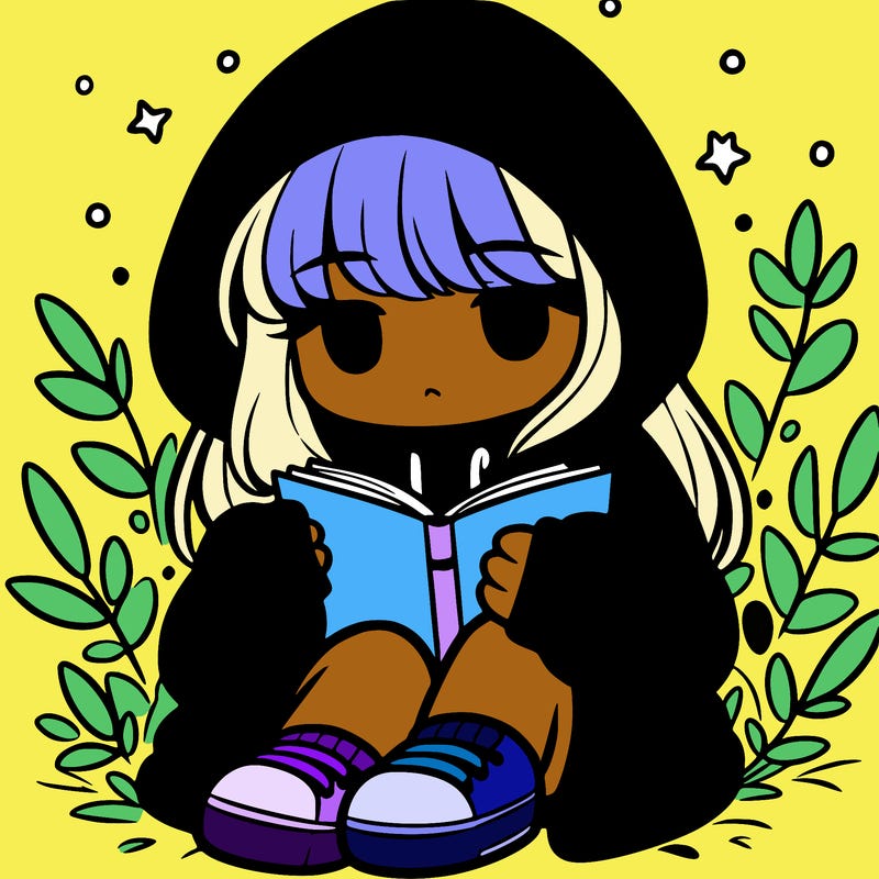 girl in oversized hoodie reading a book