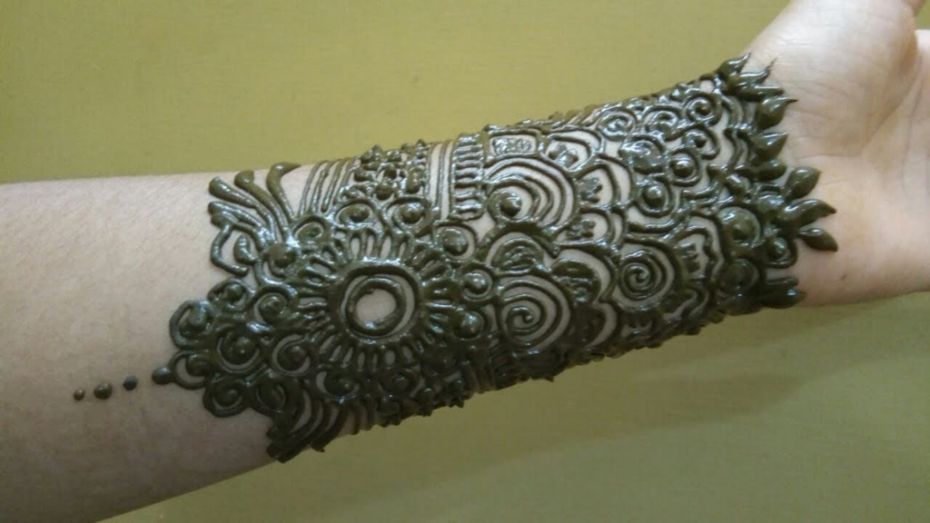 Detailed henna mehndi pattern on the forearm and wrist
