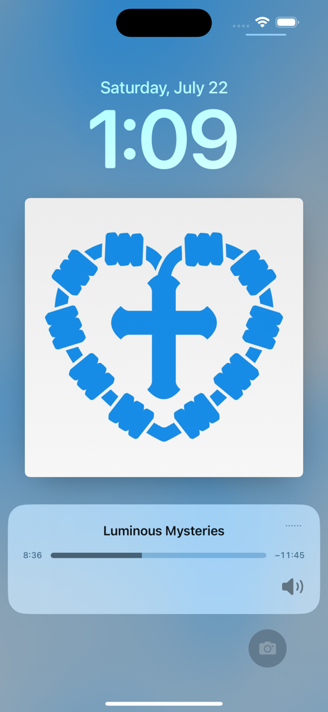 Rosary Army - iPhone lock screen displaying the Rosary Army app playing the Luminous Mysteries with a blue heart-shaped rosary illustration.
