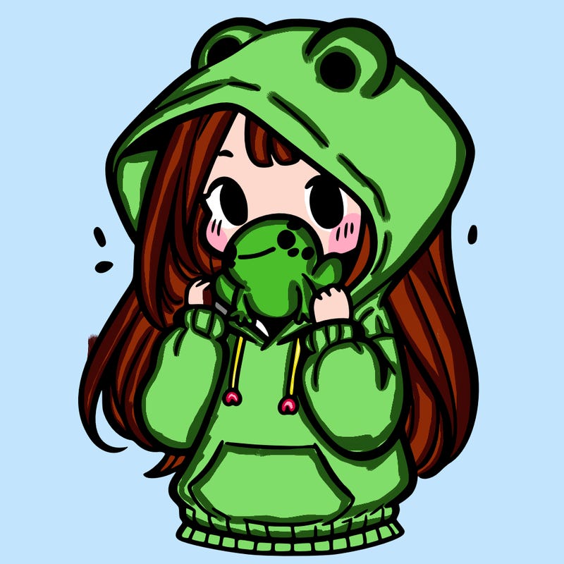 a girl holding a froggy hoodie