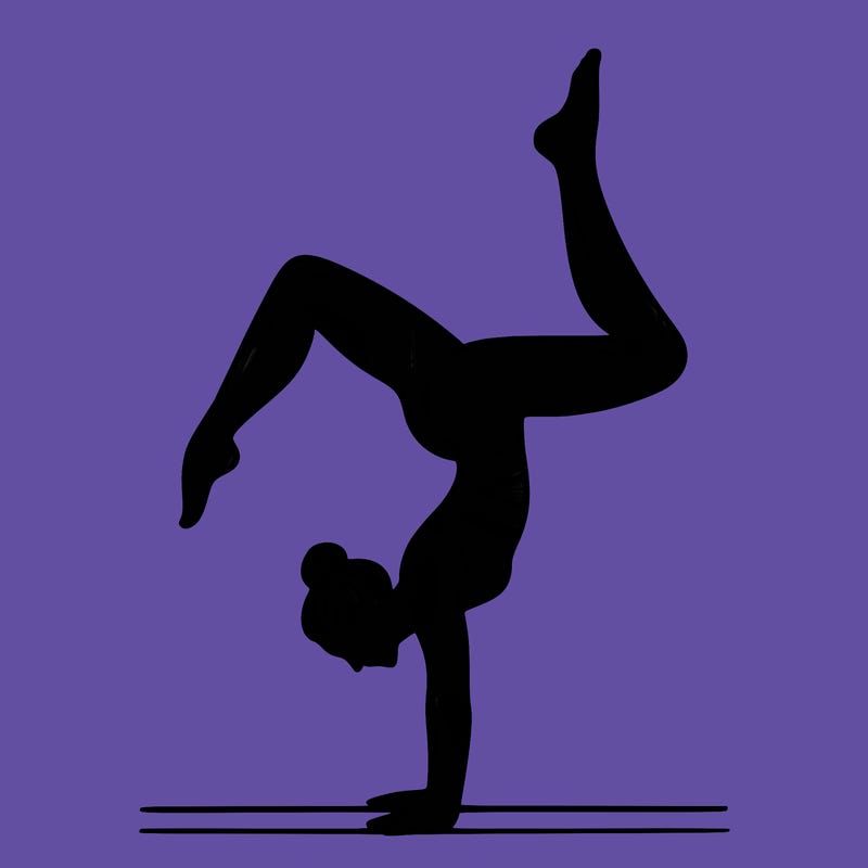 a woman doing a handstand