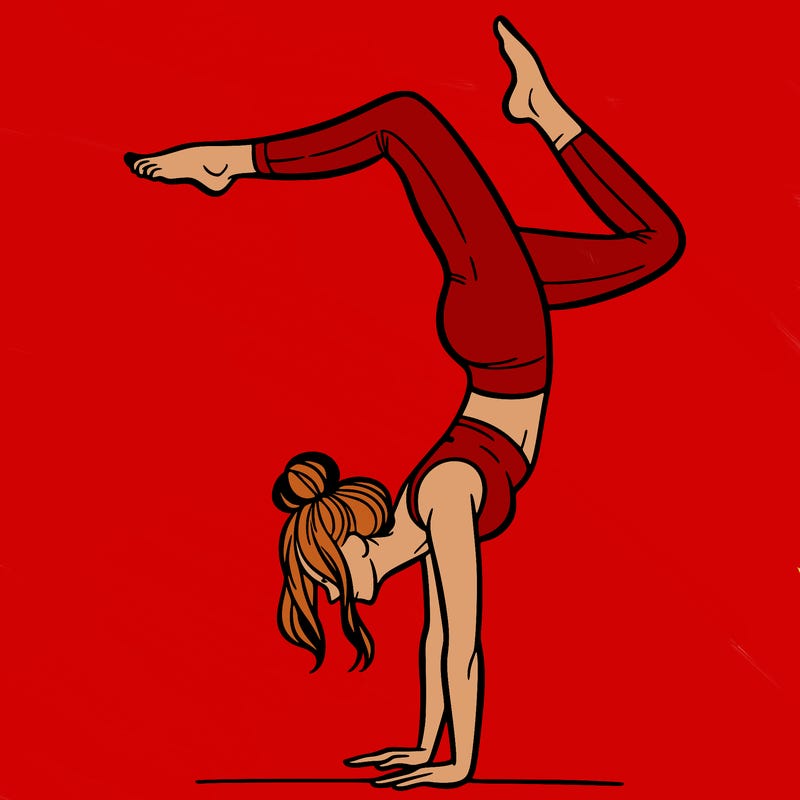 a woman doing a handstand