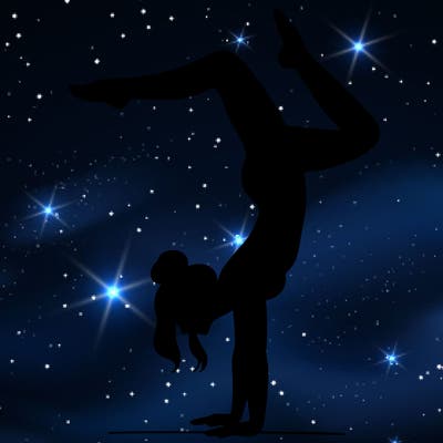 a woman doing a handstand