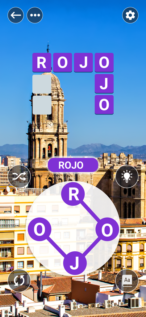Screenshot of Ciudad de Palabras gameplay showing a Spanish word puzzle over a city cathedral background