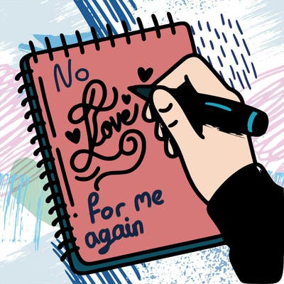 a hand writing “love” in calligraphy on a notebook