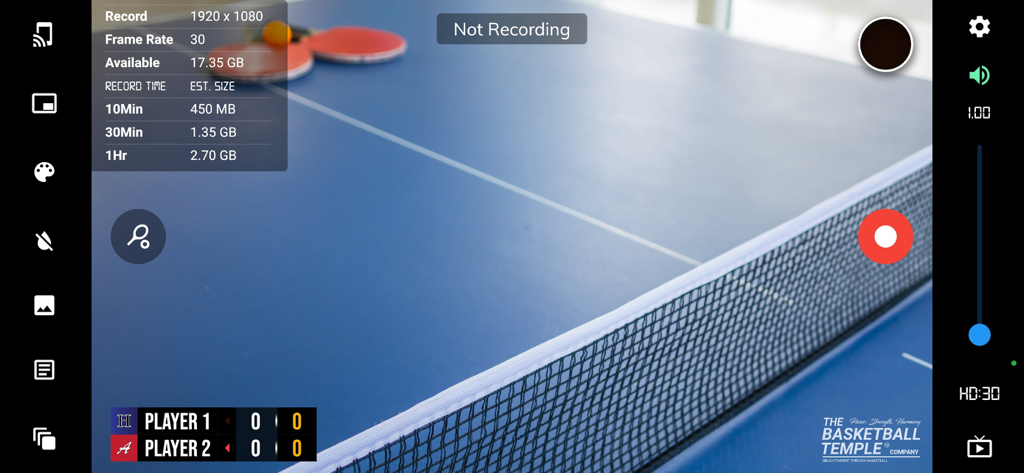 A screenshot of the BT Table Tennis Camera app interface showing a table tennis table with a professional score overlay and recording controls.