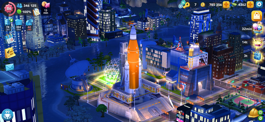 SimCity BuildIt - Vista notturna della città di SimCity BuildIt con un centro spaziale e un razzo